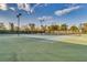Well-lit tennis courts with ample space for players at 2555 Brassica Dr, North Port, FL 34289