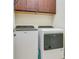 Convenient laundry room with Whirlpool washer and dryer at 2555 Brassica Dr, North Port, FL 34289