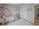 bedroom with rainbow wall art and ample closet space at 725 Essex Ave, Port Charlotte, FL 33948