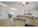 Bright and spacious living room with large sectional sofa, and open floor plan at 725 Essex Ave, Port Charlotte, FL 33948