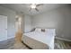 Bright bedroom with ceiling fan, large bed, and tile flooring at 725 Essex Ave, Port Charlotte, FL 33948