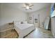 Spacious bedroom with ceiling fan, large bed, and tile flooring at 725 Essex Ave, Port Charlotte, FL 33948