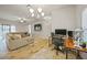 Open concept living room with sectional sofa and dedicated workspace at 725 Essex Ave, Port Charlotte, FL 33948