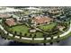 Aerial view of community clubhouse and surrounding landscape at 13948 Miranese St, Venice, FL 34293