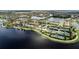 Community features: large lake, tennis courts, and clubhouse at 13948 Miranese St, Venice, FL 34293