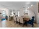 Bright dining room with a wood table and blue velvet chairs at 13948 Miranese St, Venice, FL 34293