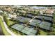 Aerial view of multiple tennis courts in a community at 13948 Miranese St, Venice, FL 34293