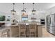 Gourmet kitchen with granite countertops and island with seating at 13948 Miranese St, Venice, FL 34293