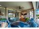 Relaxing covered patio with comfortable seating, overlooking the pool at 13948 Miranese St, Venice, FL 34293
