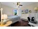 Bedroom with a bed, desk, and window at 13948 Miranese St, Venice, FL 34293