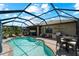 Inviting pool area with spacious patio and outdoor kitchen at 13948 Miranese St, Venice, FL 34293