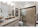 Bathroom with granite vanity, shower, and toilet at 13948 Miranese St, Venice, FL 34293