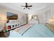 Main bedroom with large TV and dresser at 13948 Miranese St, Venice, FL 34293