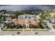 Community clubhouse with pool and landscaping at 13948 Miranese St, Venice, FL 34293