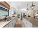 Open concept kitchen featuring granite countertops and upgraded cabinetry at 13948 Miranese St, Venice, FL 34293