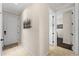 Clean hallway with light walls and tiled floor at 13948 Miranese St, Venice, FL 34293