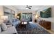 Open living space featuring a cozy seating area and access to a relaxing backyard at 13948 Miranese St, Venice, FL 34293