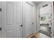 Bright hallway with white doors and access to other rooms at 13948 Miranese St, Venice, FL 34293