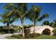 Landscaped area with a charming bridge over a lake at 13948 Miranese St, Venice, FL 34293