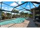 Relaxing pool area with screened enclosure and comfortable seating at 13948 Miranese St, Venice, FL 34293