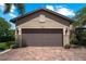 Two-car garage with brick paver driveway at 13948 Miranese St, Venice, FL 34293