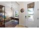 Bright home office with built-in shelves, comfortable seating and large window at 13948 Miranese St, Venice, FL 34293