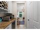 Convenient butler's pantry with wine storage and beverage cooler at 13948 Miranese St, Venice, FL 34293