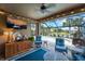 Enjoy this relaxing screened-in patio with pool and lush landscaping views at 13948 Miranese St, Venice, FL 34293