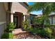 Inviting entryway with columns, lush landscaping and brick pavement at 13948 Miranese St, Venice, FL 34293