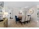 Elegant dining room with a wood table and neutral-toned chairs at 13948 Miranese St, Venice, FL 34293