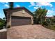Spacious two-car garage with paver driveway at 13948 Miranese St, Venice, FL 34293