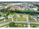 Aerial view featuring a residential area alongside a tranquil canal with nearby commercial spaces at 3107 Easy St, Port Charlotte, FL 33952