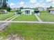 Charming home with a well-manicured lawn and lovely landscaping at 3107 Easy St, Port Charlotte, FL 33952