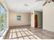 Sunlit living room with tile floors and multiple windows offering ample natural light at 3107 Easy St, Port Charlotte, FL 33952