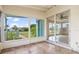 Enclosed porch with tile floors, multiple windows with front yard views at 3107 Easy St, Port Charlotte, FL 33952