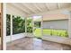 Screened-in porch with tile flooring and view of the backyard at 3107 Easy St, Port Charlotte, FL 33952