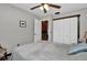 Cozy bedroom with white closet doors and ceiling fan at 481 Ricold Ter, Port Charlotte, FL 33954