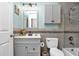 Clean bathroom with gray vanity and bathtub at 481 Ricold Ter, Port Charlotte, FL 33954