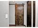 Barn-style interior door adds rustic charm to this home at 481 Ricold Ter, Port Charlotte, FL 33954