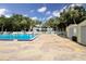 Community pool with lounge chairs and a storage shed at 481 Ricold Ter, Port Charlotte, FL 33954
