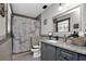 Modern bathroom with gray vanity and a shower at 481 Ricold Ter, Port Charlotte, FL 33954