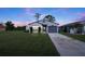 Single-story home with attached garage and well-maintained lawn at 481 Ricold Ter, Port Charlotte, FL 33954