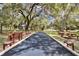 Relaxing bocce ball court shaded by large trees at 481 Ricold Ter, Port Charlotte, FL 33954