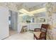 Vanity area with a large mirror and floral wallpaper at 5480 Sea Edge Dr, Punta Gorda, FL 33950