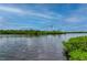 Scenic view of calm water, lush greenery, and a clear sky at 5480 Sea Edge Dr, Punta Gorda, FL 33950