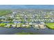 Aerial view of waterfront home with private dock and lush landscaping at 5480 Sea Edge Dr, Punta Gorda, FL 33950