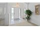 Spacious entryway with tiled floor and large plant at 5480 Sea Edge Dr, Punta Gorda, FL 33950