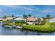 Waterfront home boasts a private dock and beautifully landscaped yard at 5480 Sea Edge Dr, Punta Gorda, FL 33950