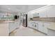 Well-equipped kitchen with white cabinets and ample counter space at 5480 Sea Edge Dr, Punta Gorda, FL 33950