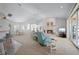 Open living room with a fireplace and view of kitchen and patio at 5480 Sea Edge Dr, Punta Gorda, FL 33950